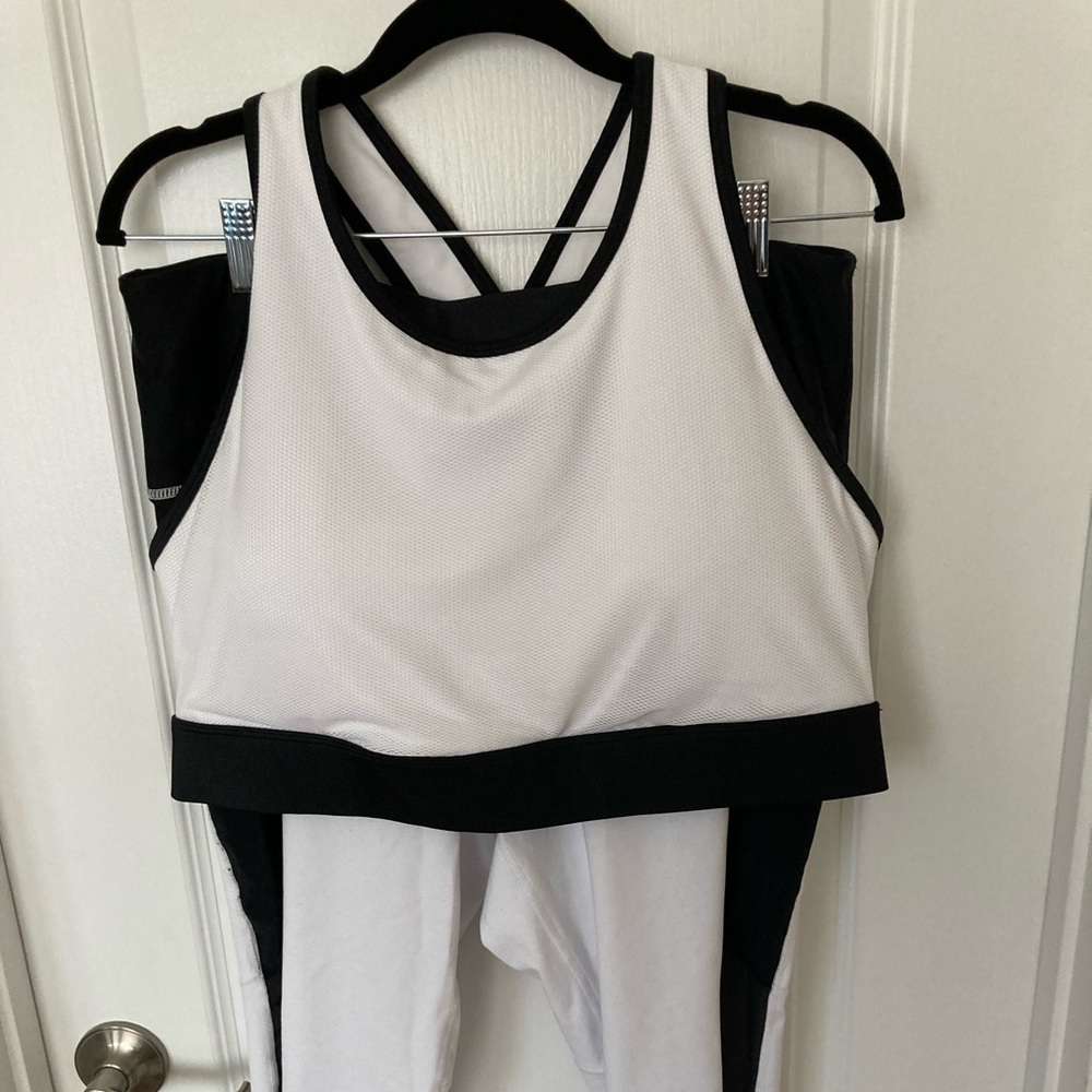 NWOT Fabletics sports bra and 7/8 leggings. White with black trim.
